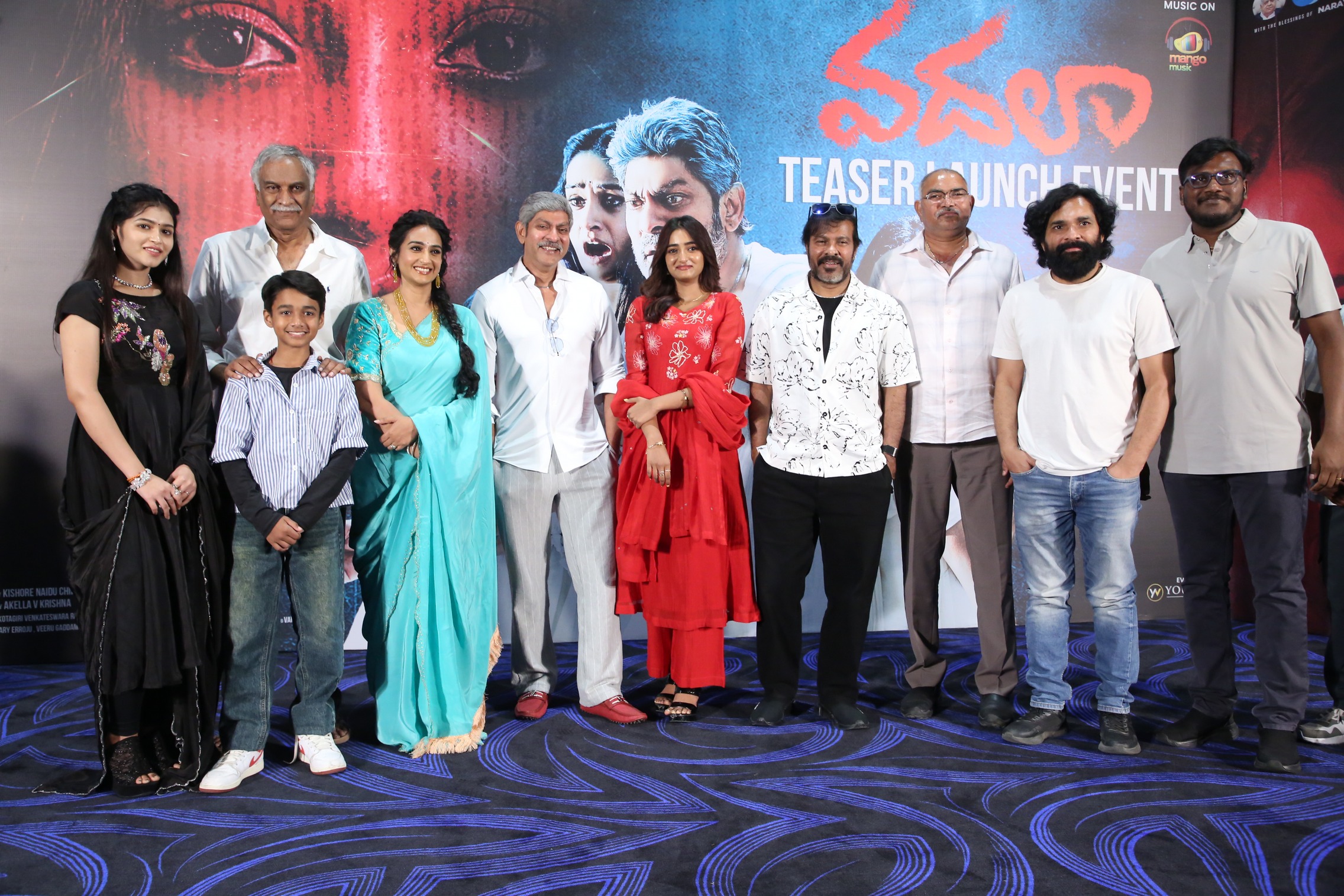 Vadhala cast, crew, and guests posing for group photo at launch