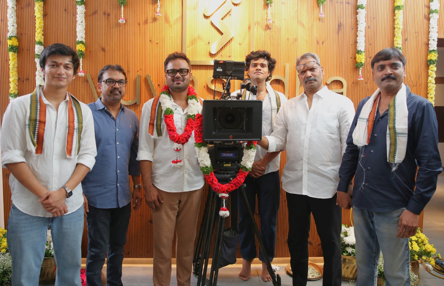 DOP and film crew posing with camera at Vishwak Sen movie launch