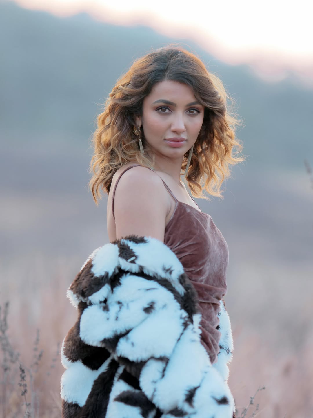 Tejaswi Madivada wearing velvet dress and fur coat