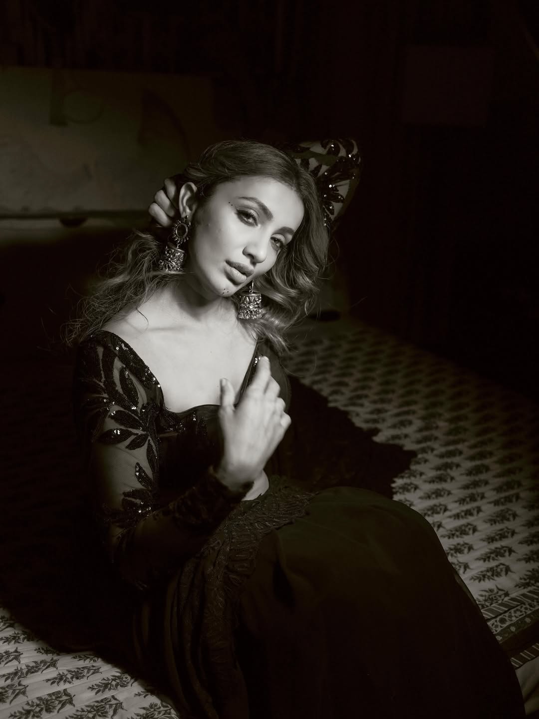 Tejaswi Madivada posing elegantly in a glamorous black-and-white fashion portrait.