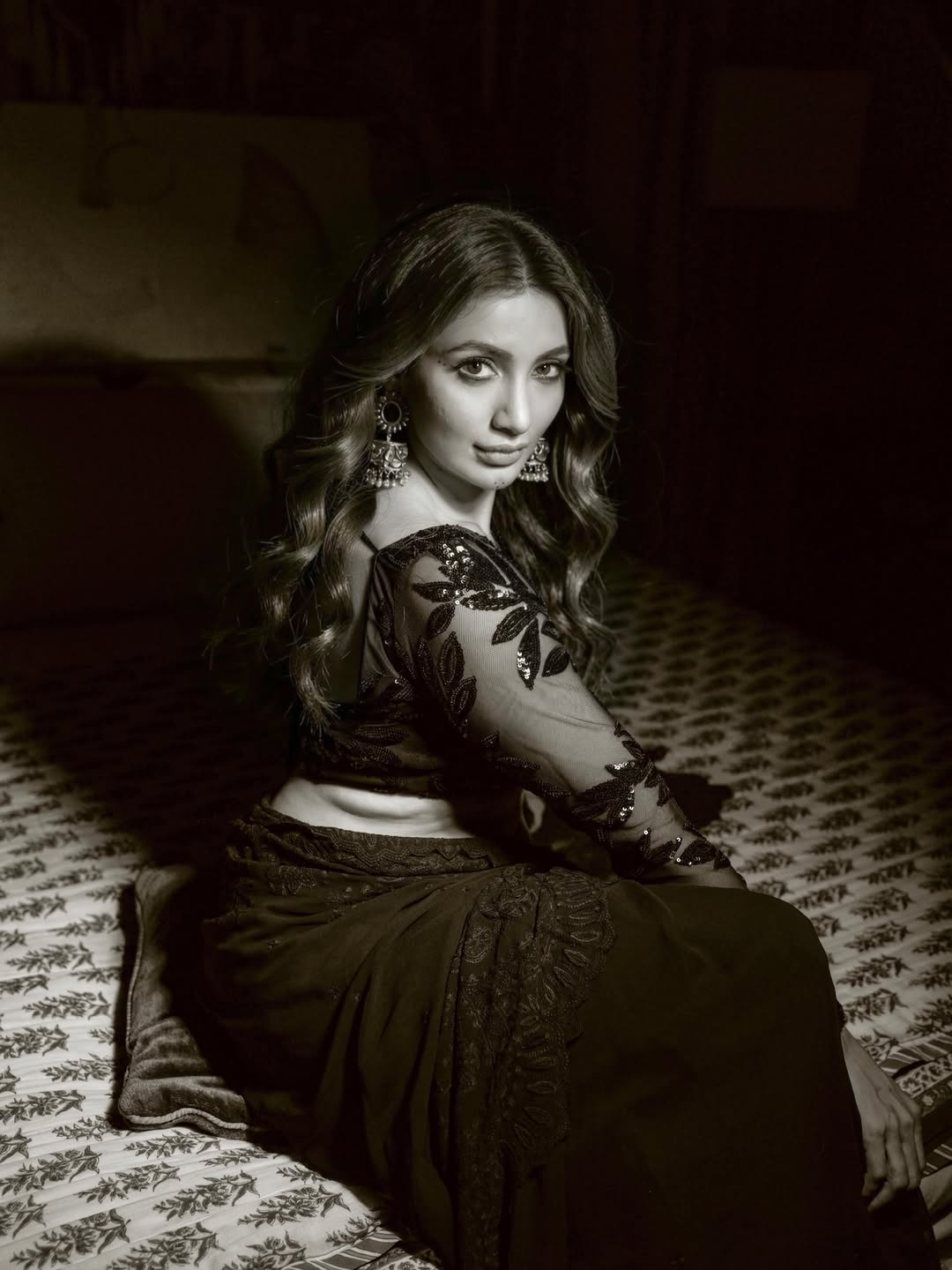 Tejaswi Madivada wearing a sparkling saree in a black-and-white editorial look.