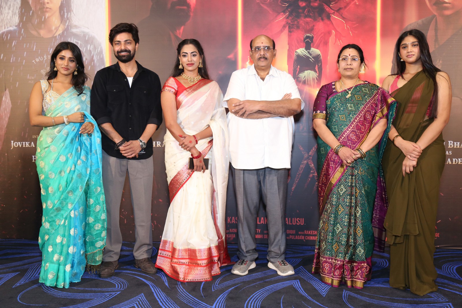 Agadha cast and makers posing at teaser launch event