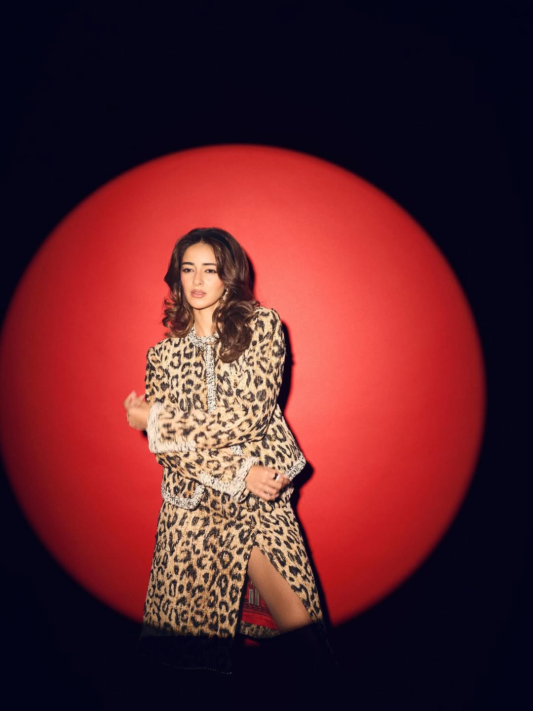 Bollywood actress Ananya Panday striking a confident pose in a trendy leopard-print co-ord set.