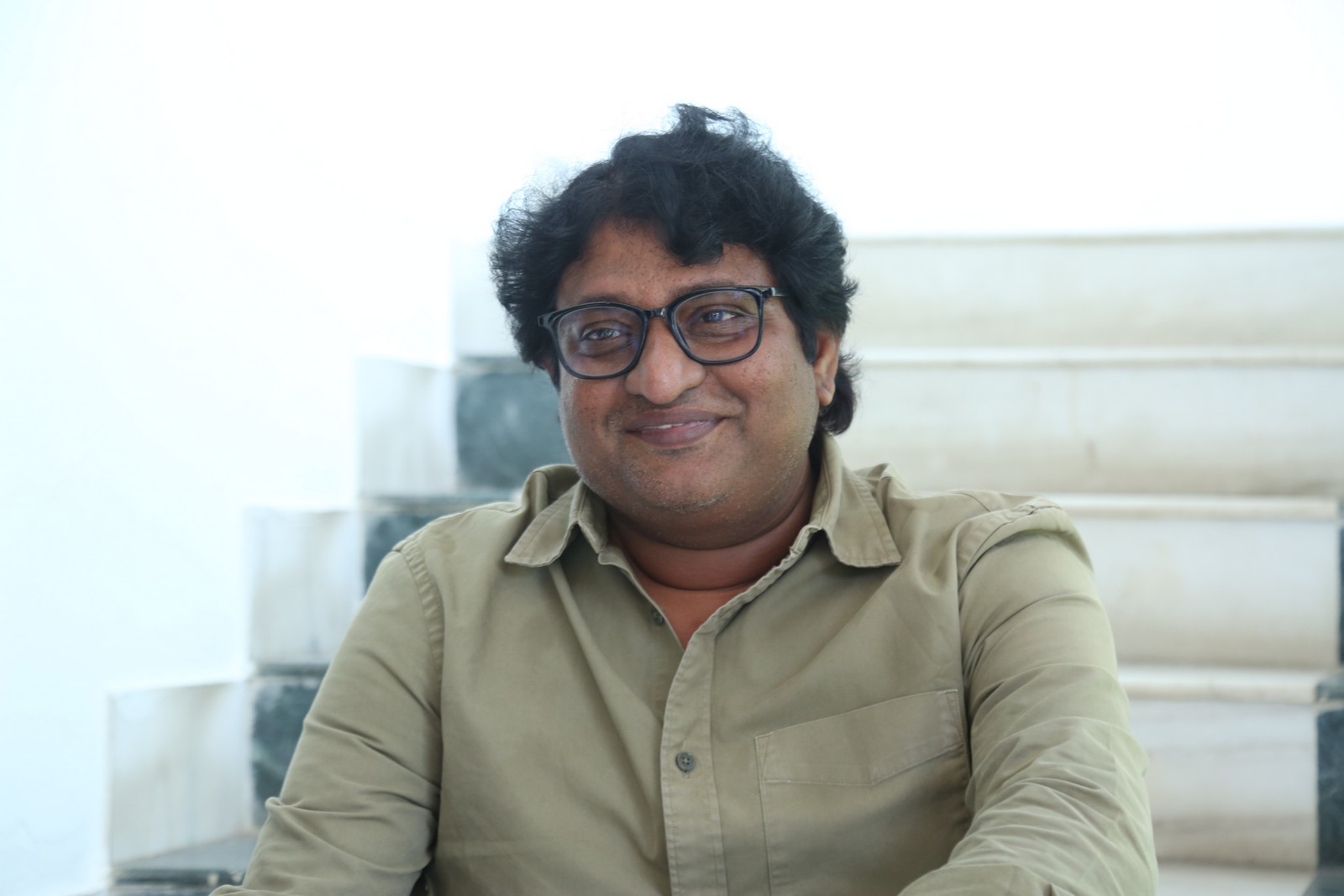 Avinash Kolla in neatly styled shirt and elegant pose
