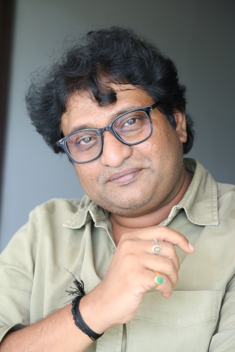 Avinash Kolla wearing a neutral shirt with stylish accessories