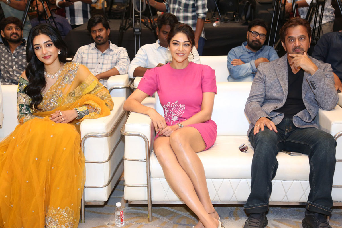 Preity Mukhundhan Abhirami and Arjun seated together on stage.