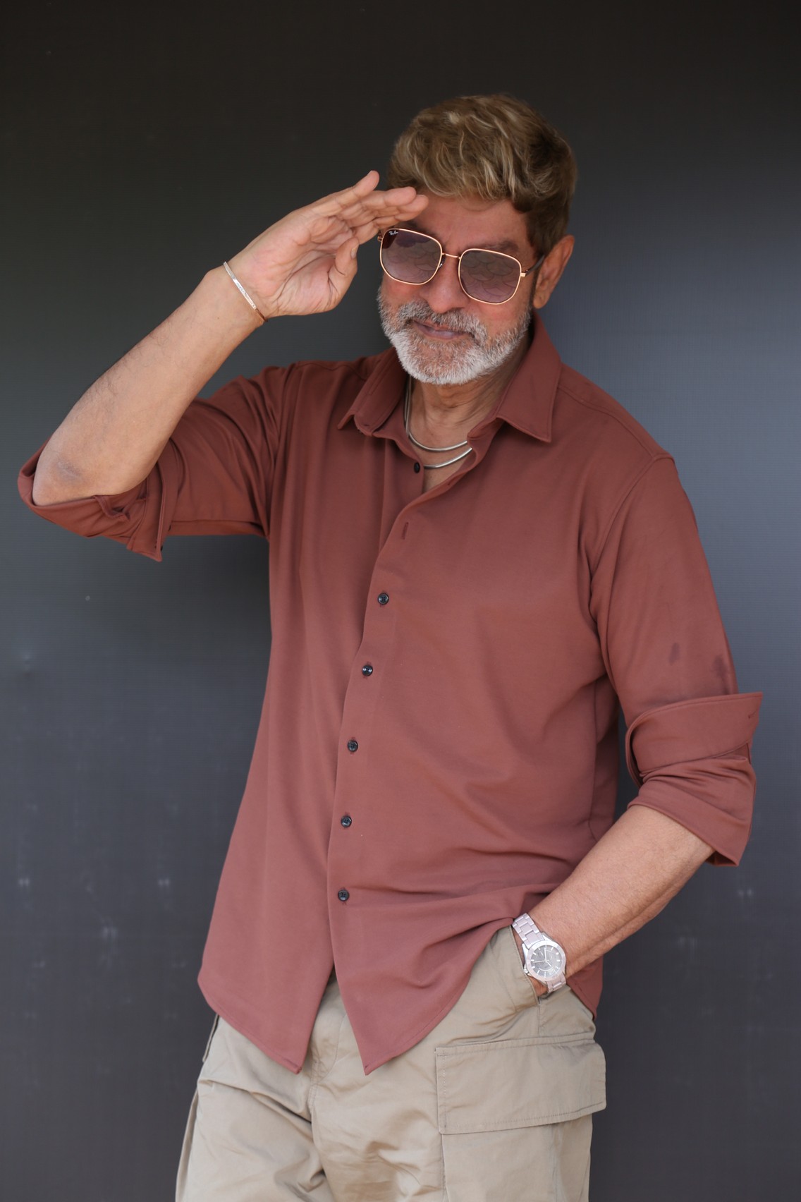 Jagapathi Babu wearing sunglasses in fashionable casual style.