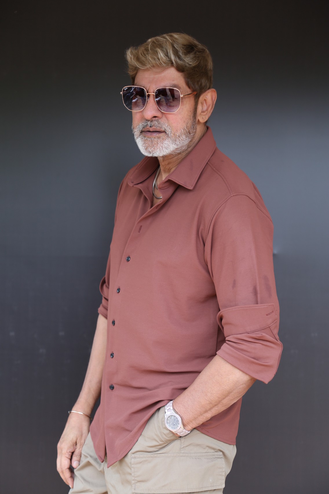 Jagapathi Babu in sharp casual shirt and wristwatch.