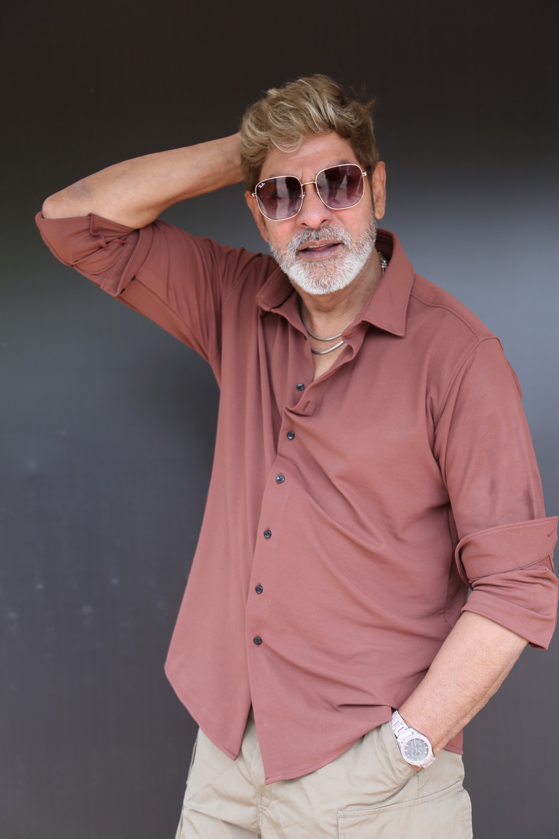 Jagapathi Babu stylish pose with sunglasses and confident look.