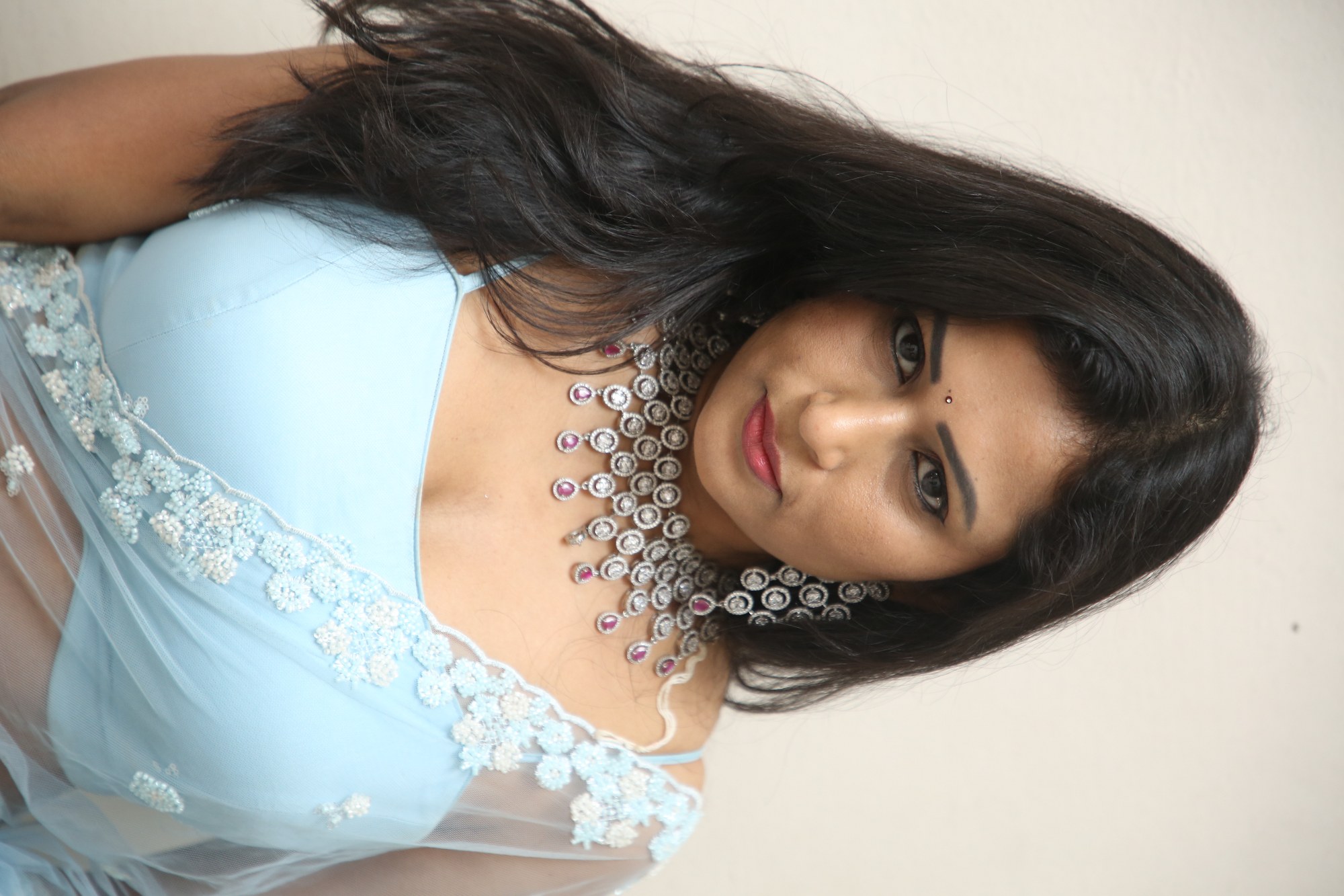 Jo Sharma blue ensemble with dazzling statement jewelry