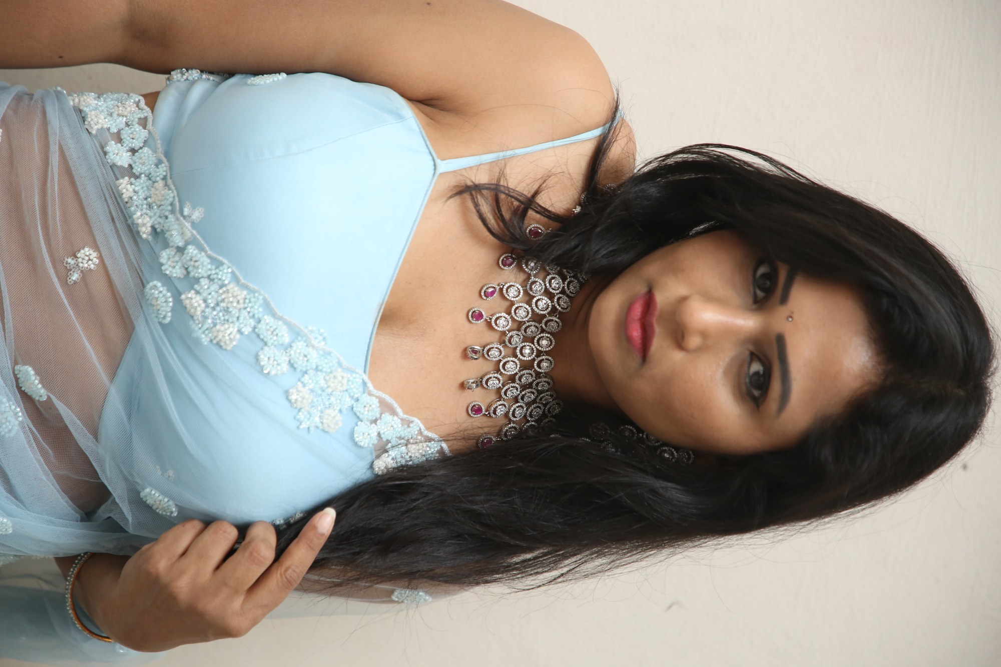 Jo Sharma chic blue outfit with dramatic flair