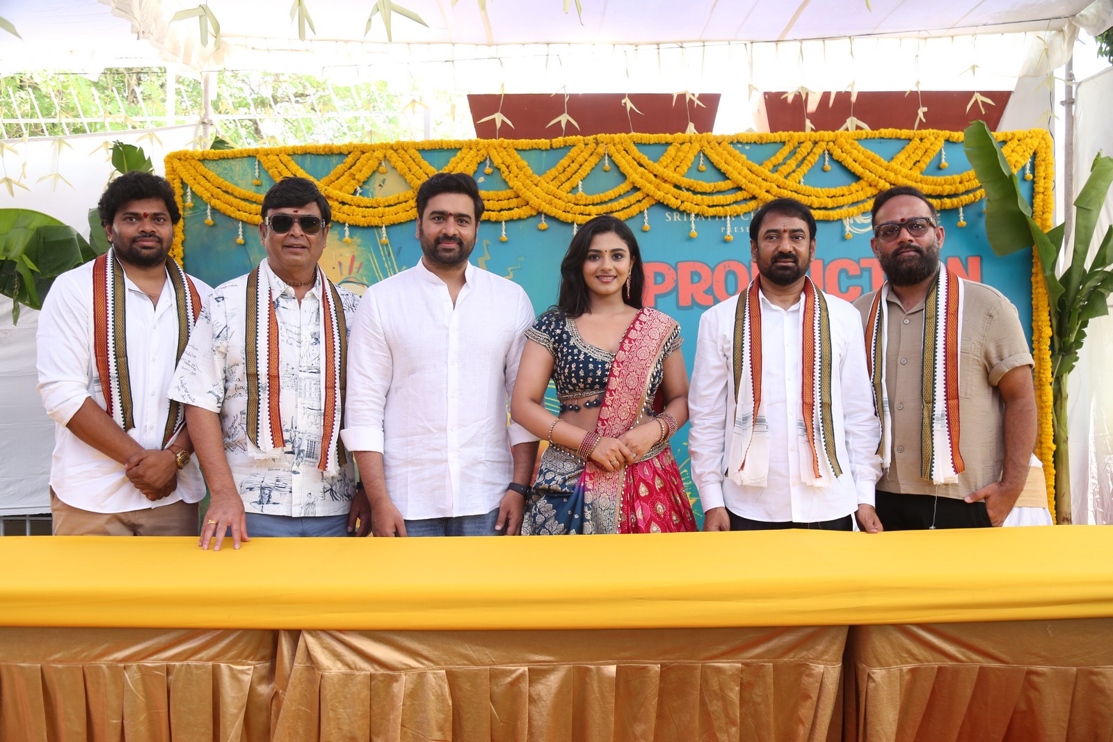 Movie team posing for media photographs