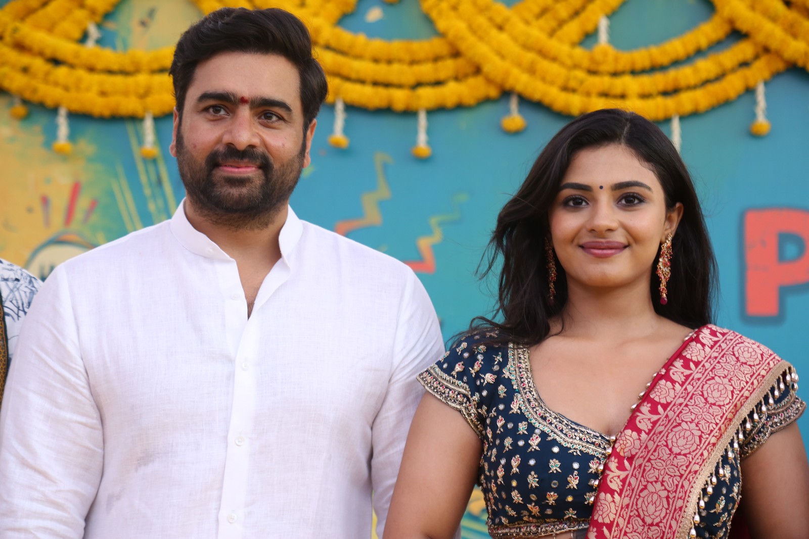 Lead pair posing at movie launch
