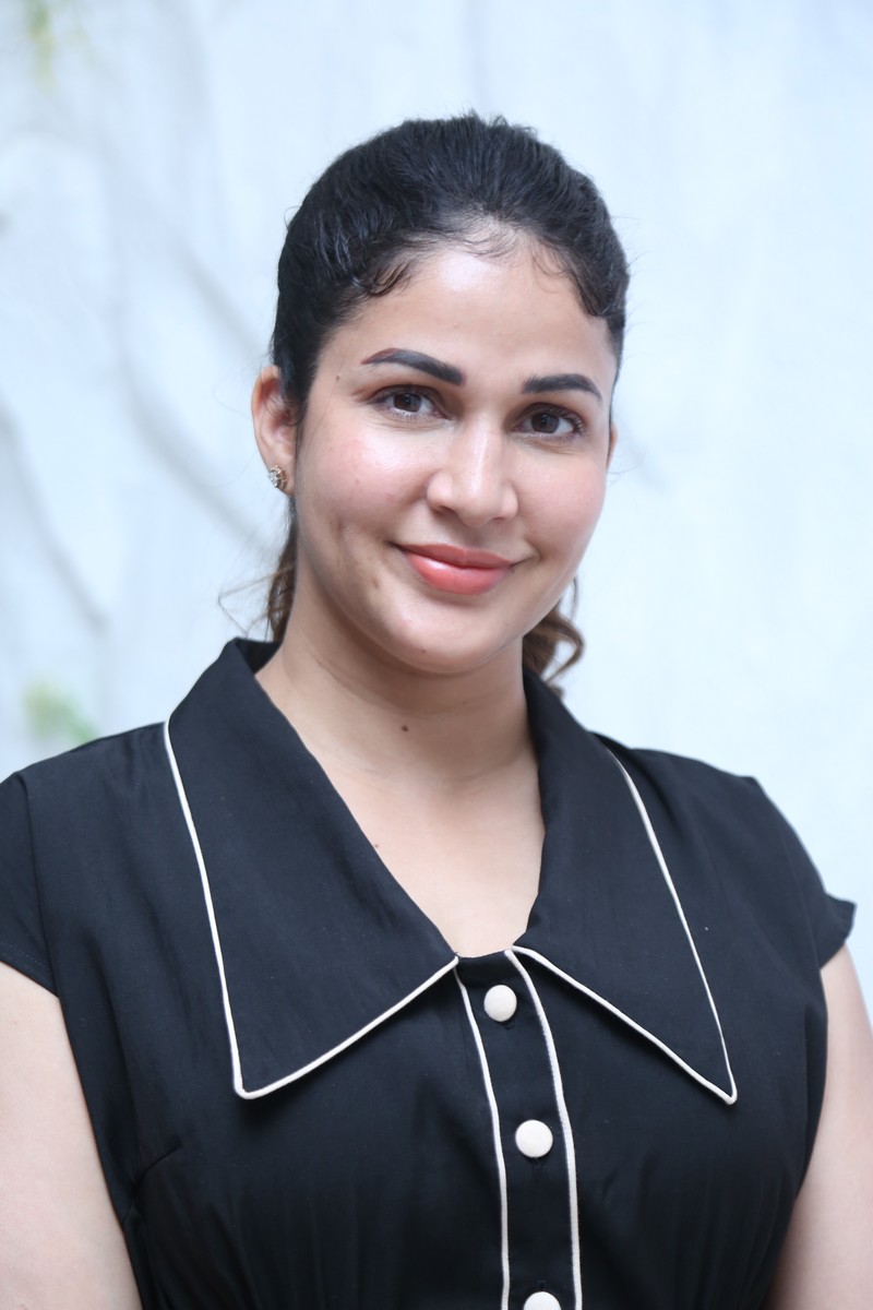 Lavanya Tripathi posing elegantly in a classic black dress