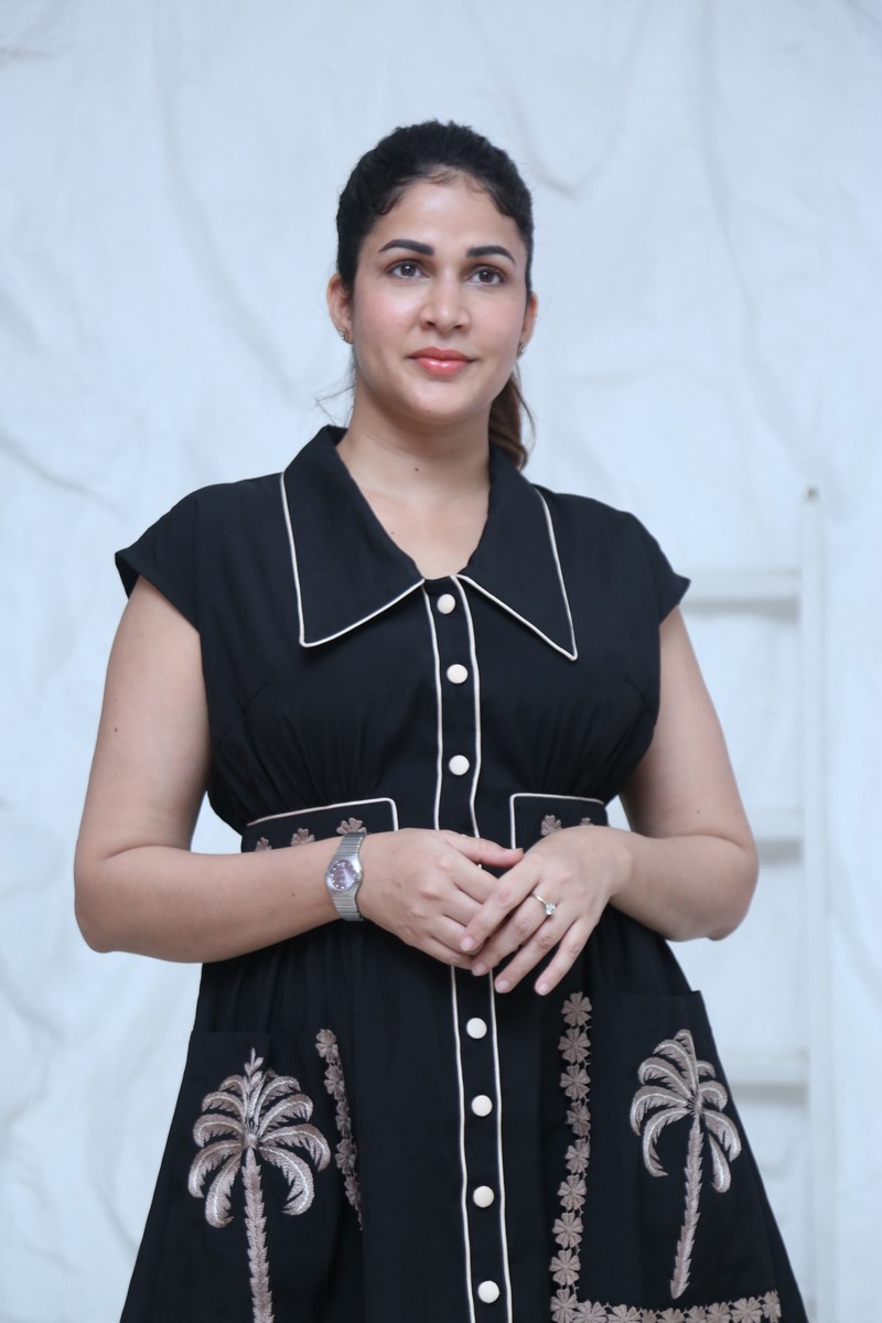 Lavanya Tripathi posing gracefully in elegant embroidered black dress