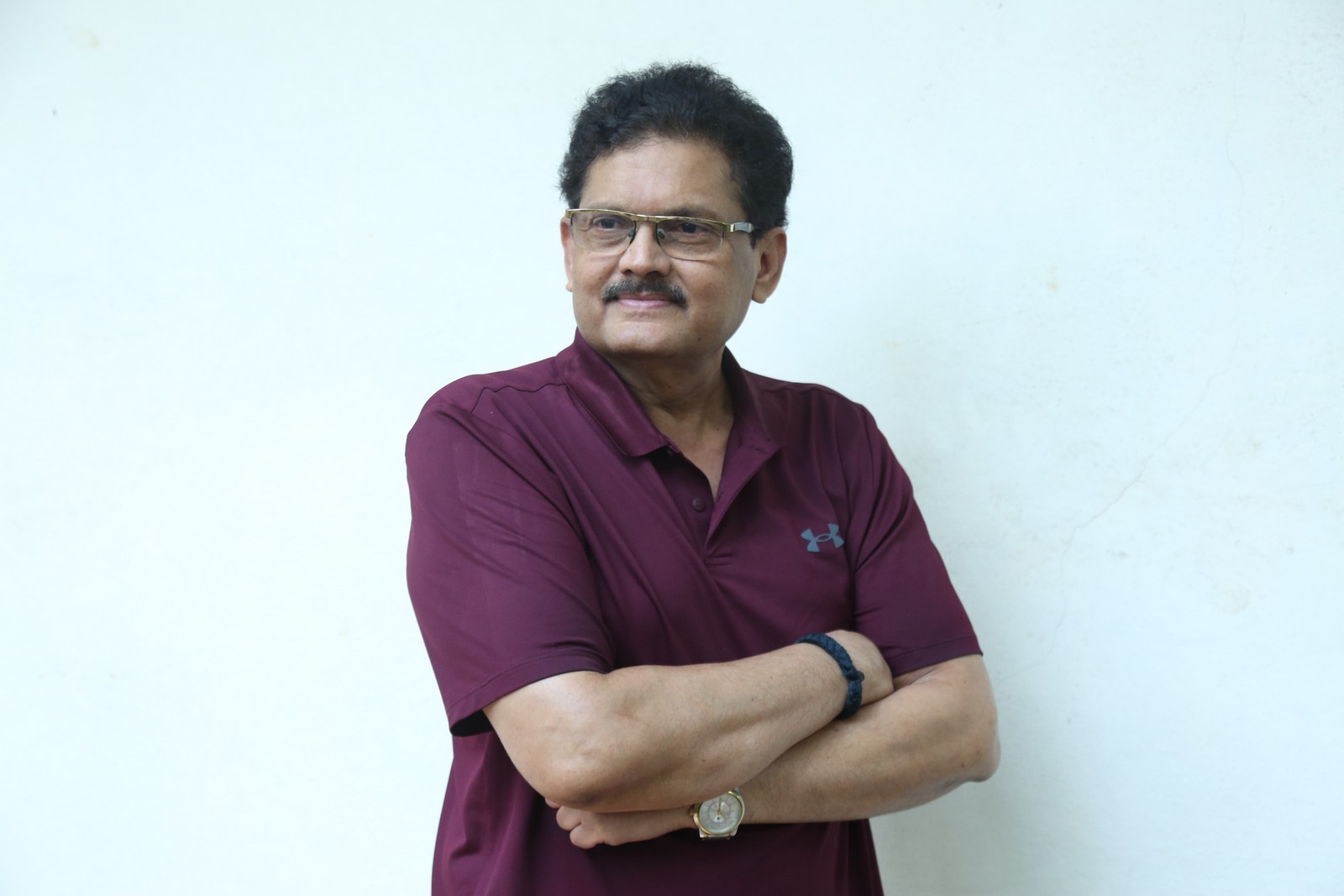 Mohan Vadlapatla posing confidently in stylish casual polo