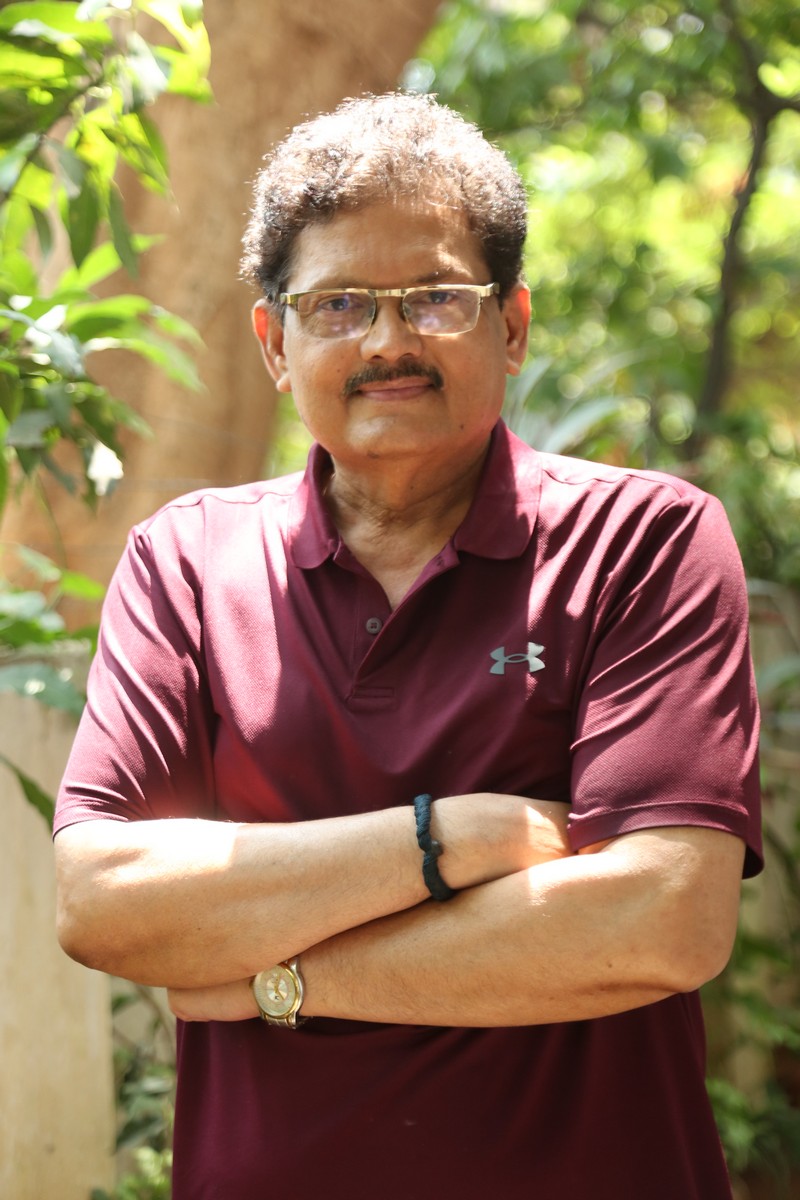 Mohan Vadlapatla displaying confident pose in sporty attire