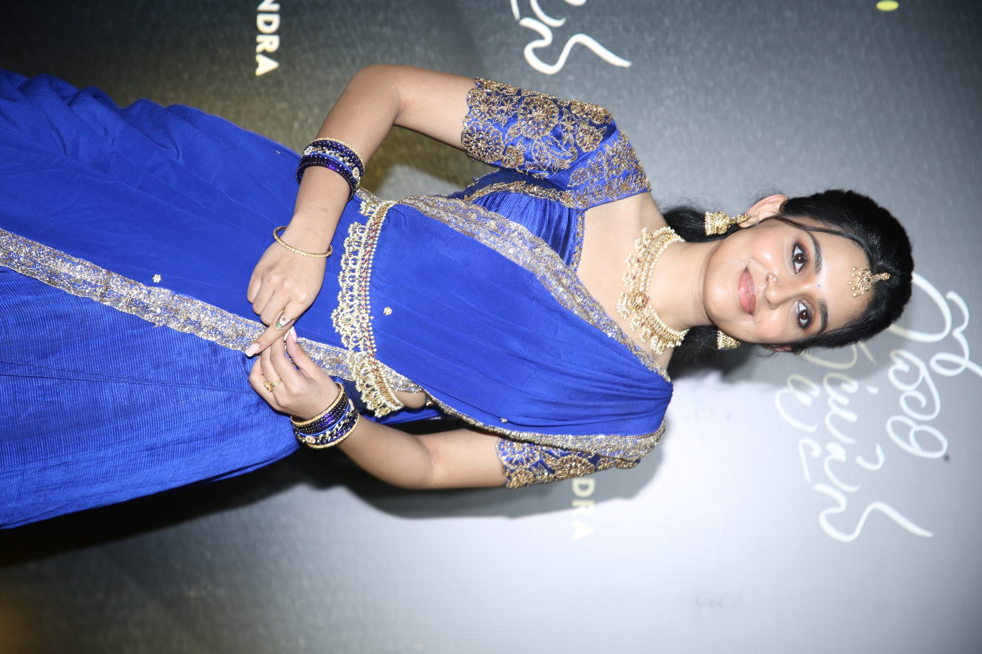 Nidhi Pradeep wearing a royal blue ethnic outfit with poised and elegant expressions.