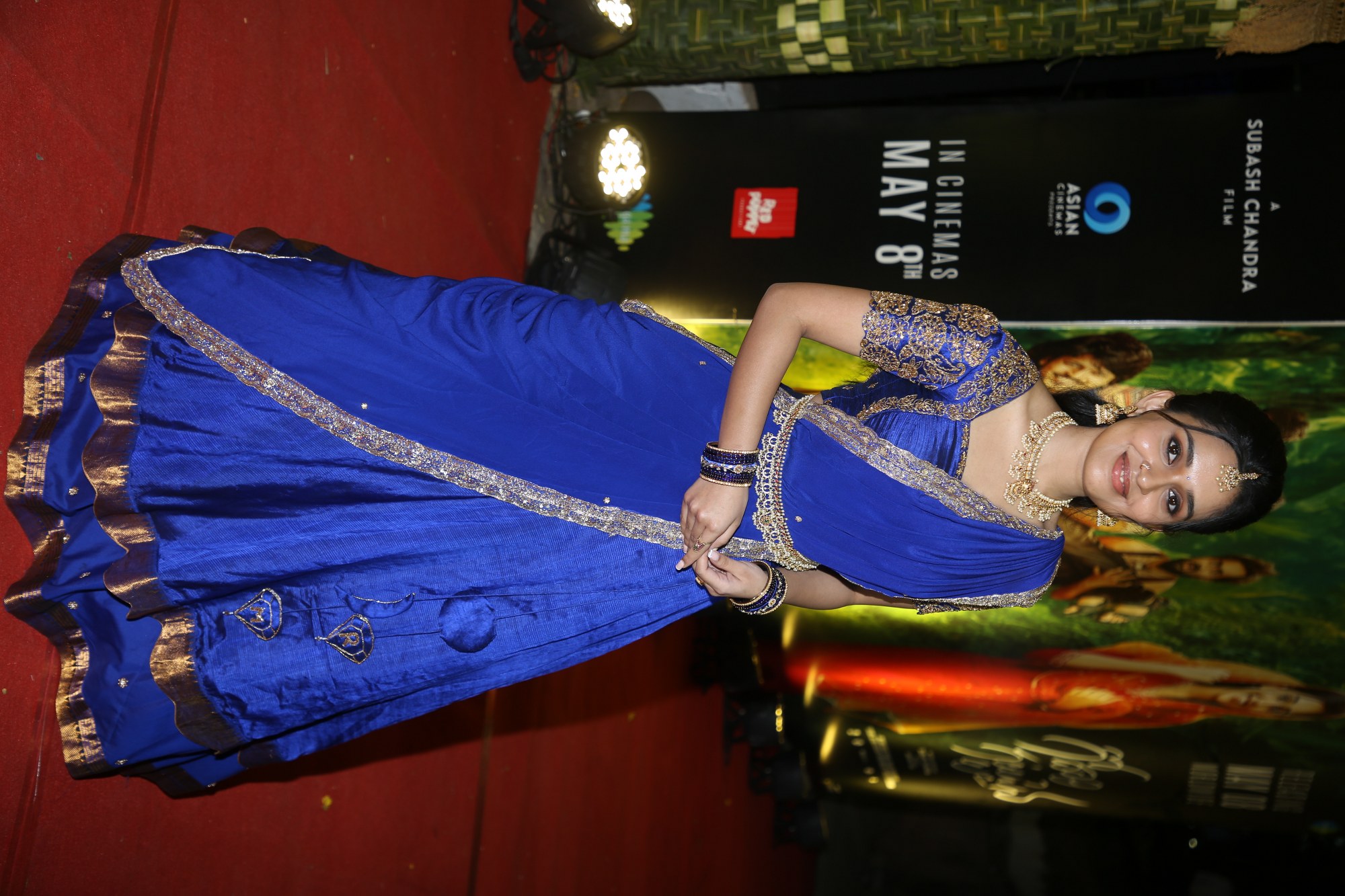 Nidhi Pradeep making a stylish appearance in a regal blue traditional ensemble.