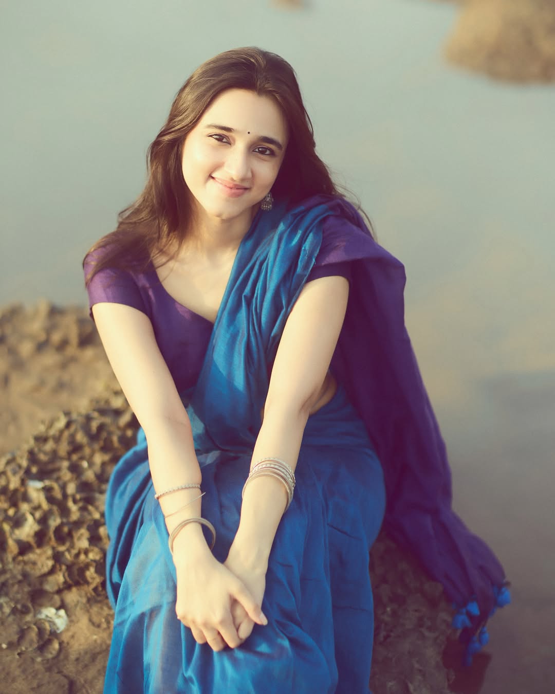 Nuveksha glowing gracefully in elegant beachside saree