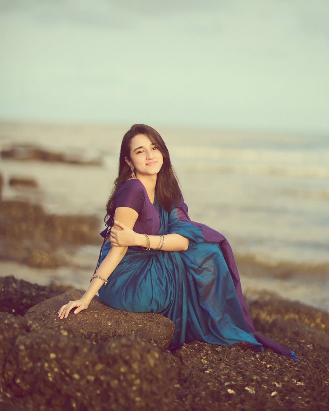 Nuveksha stunning in serene saree by seaside