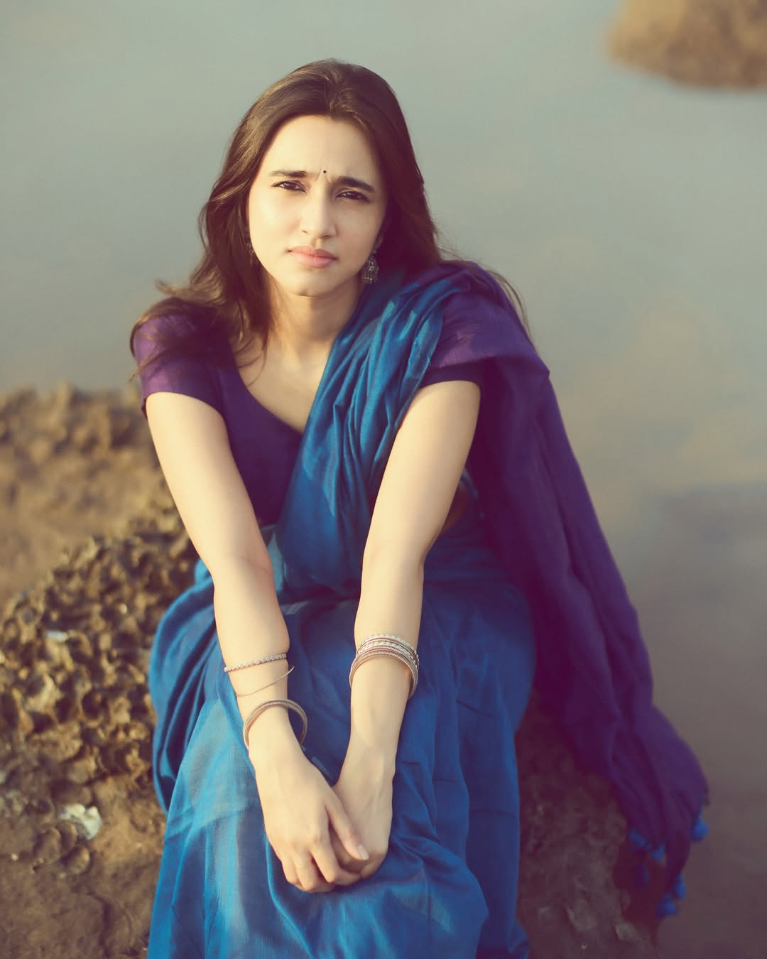 Nuveksha radiating charm in classic blue saree look