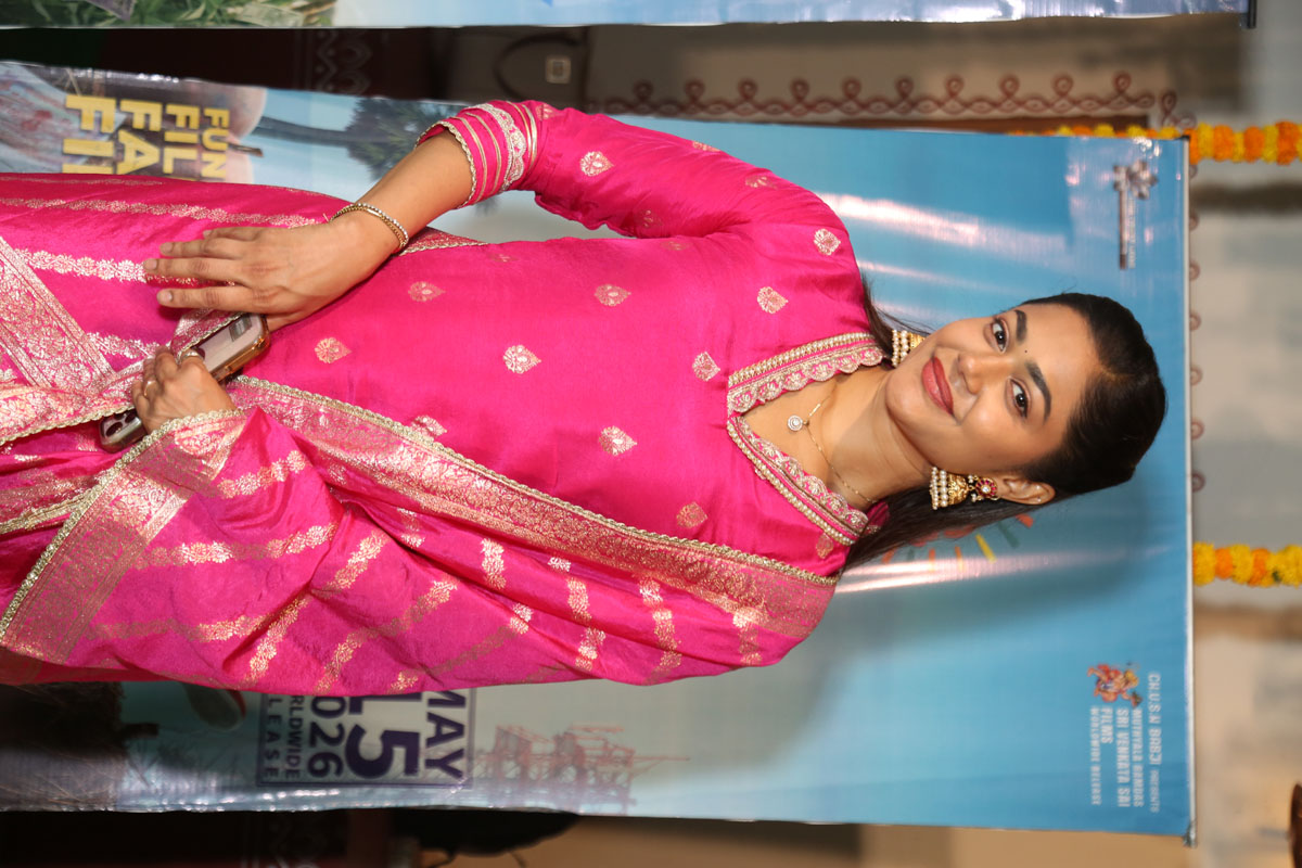 Payal Radhakrishna posing in vibrant pink outfit
