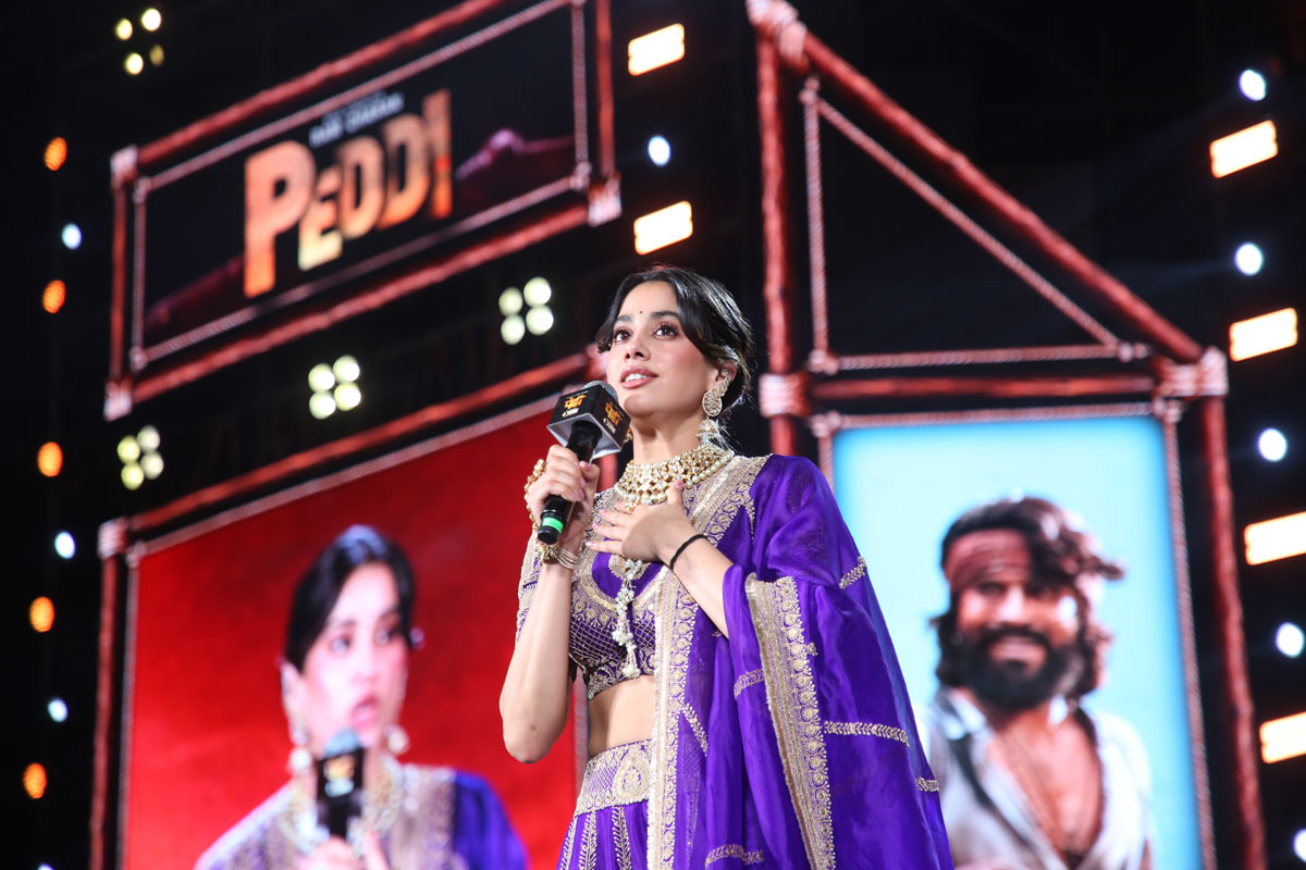 Janhvi Kapoor delivering a speech during the film promotional event.