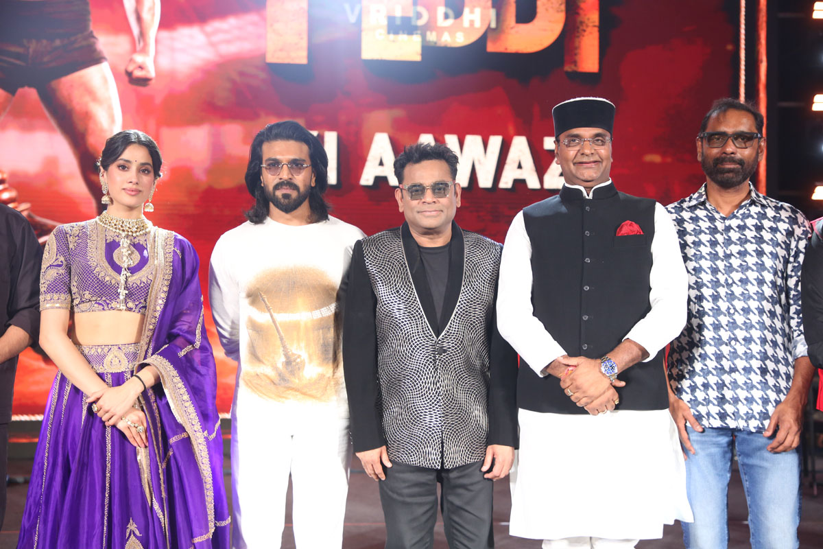 Janhvi Kapoor, Ram Charan, A.R. Rahman, Vishvas Sarang, and Venkata Satish Kilaru posing for photographers.