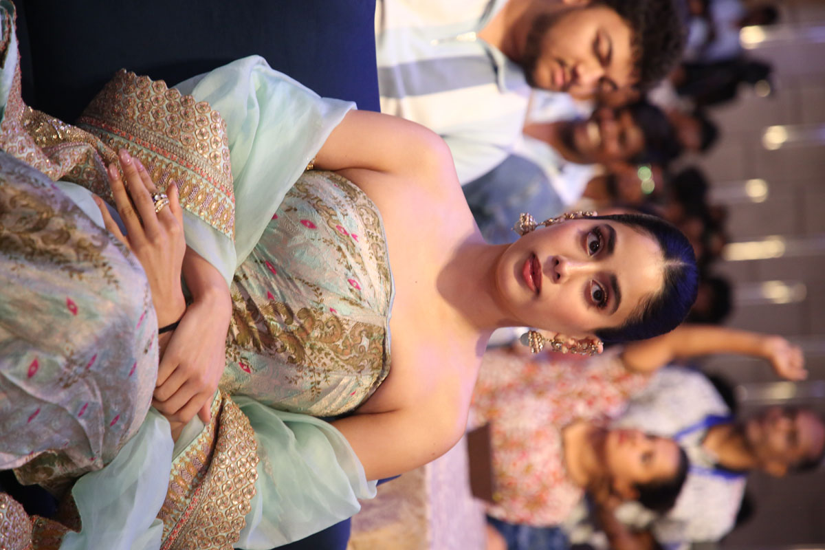 Janhvi Kapoor seated at Peddi promotional event