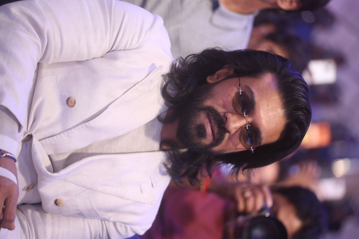 Ram Charan seated at Peddi promotional press meet