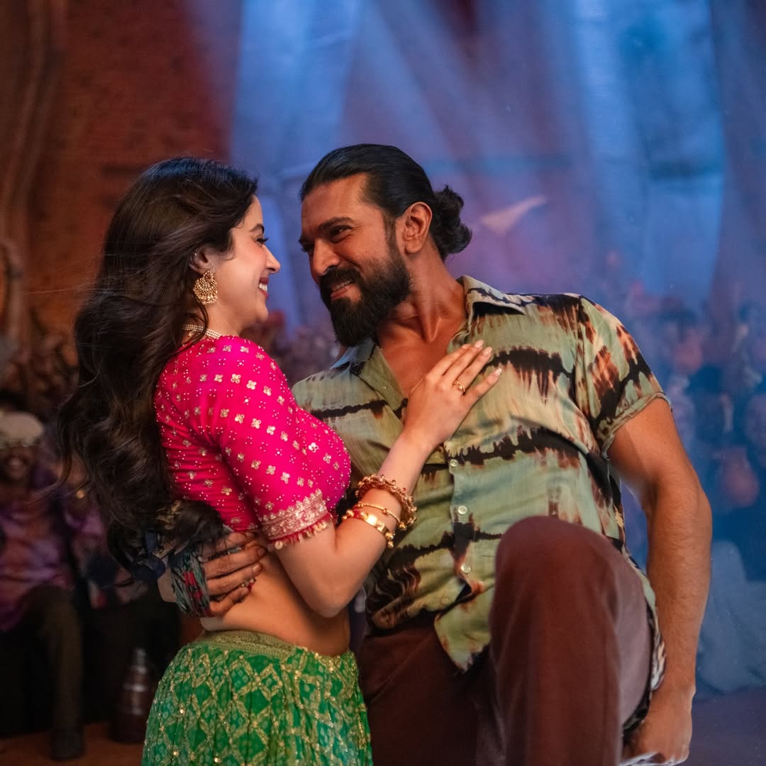 Ram Charan and Janhvi Kapoor dancing in Peddi Hellallallo song still.