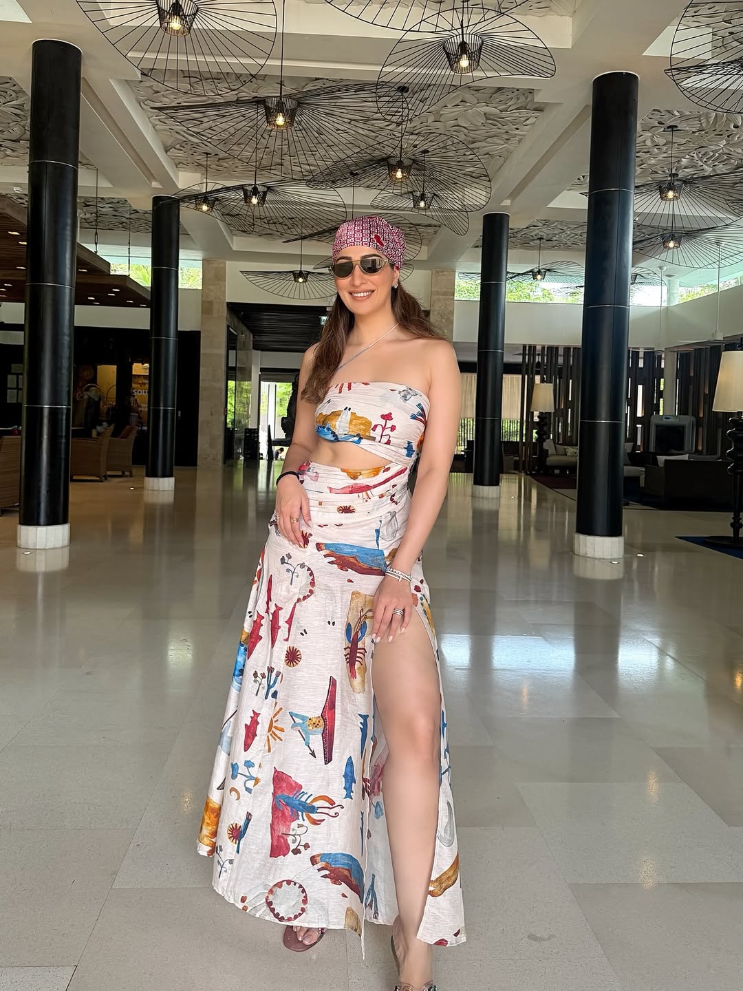 Raai Laxmi posing elegantly in stylish slit dress
