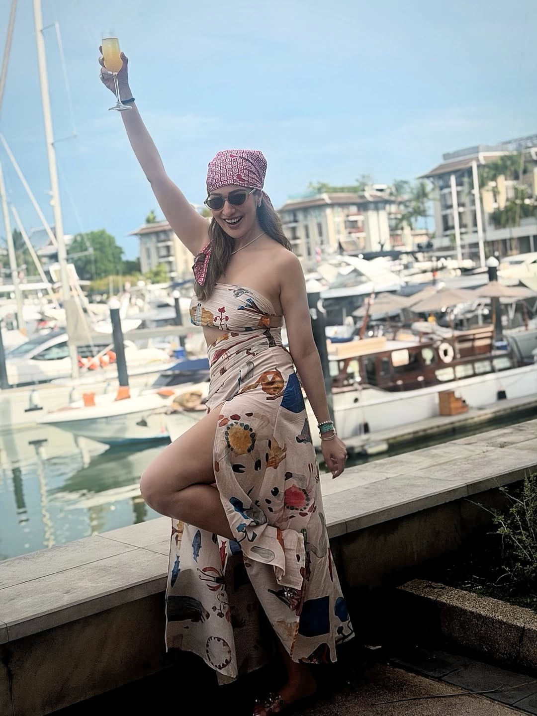 Raai Laxmi enjoying marina view in chic outfit
