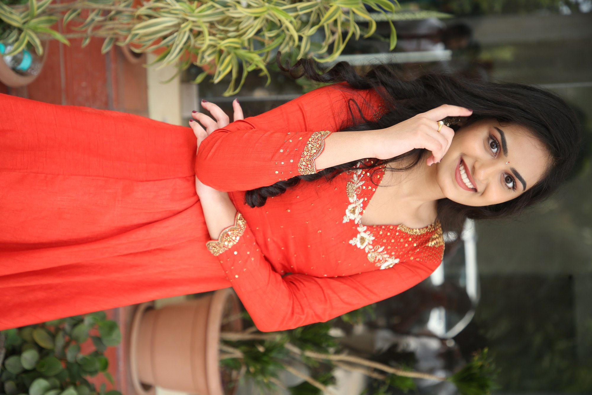 Rayancha Kokkura posing elegantly in fiery red look