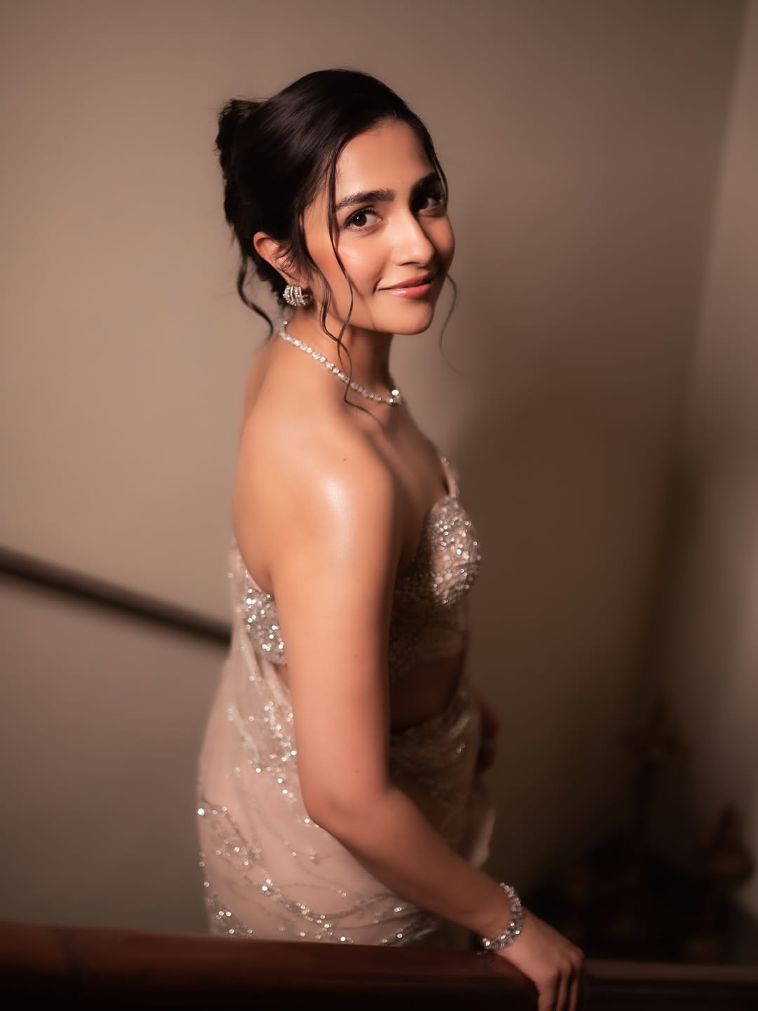Rukmini Vasanth posing in sparkling dress