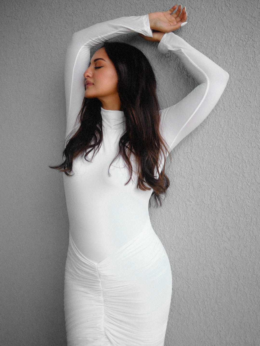 Sonakshi Sinha glamorous white outfit with soft waves