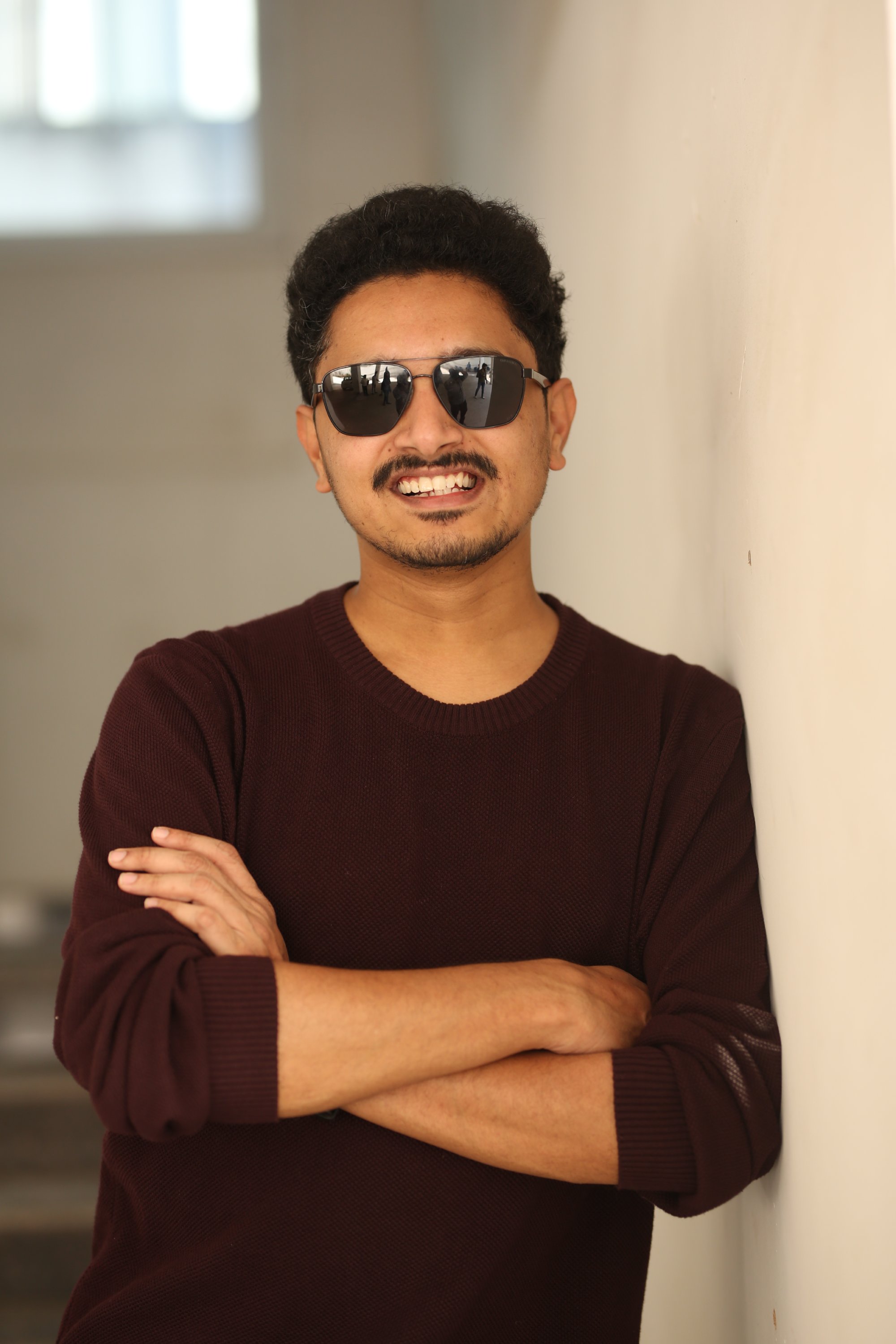 Subash Chandra confident stylish sweater look professional appearance