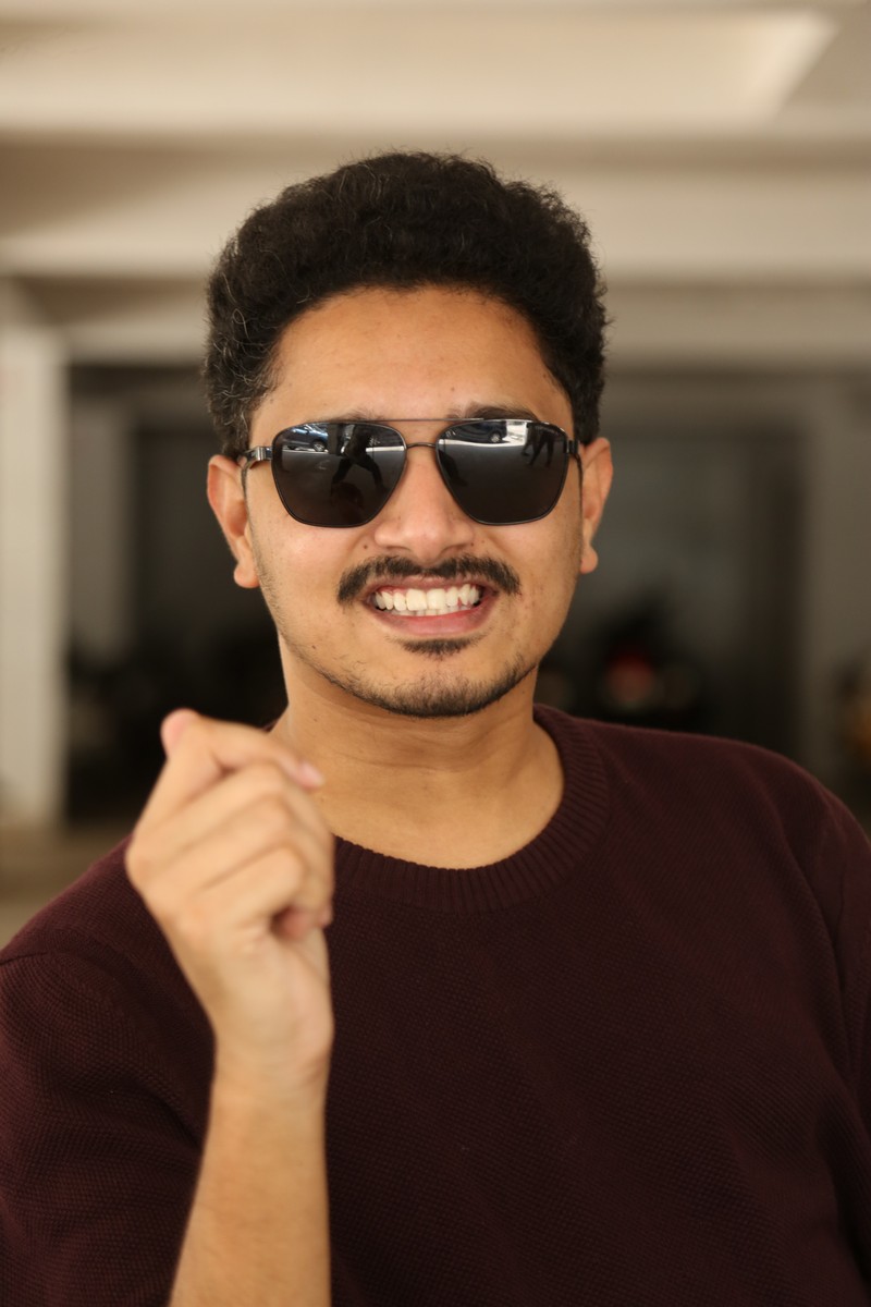 Subash Chandra confident pose sharp outfit professional look