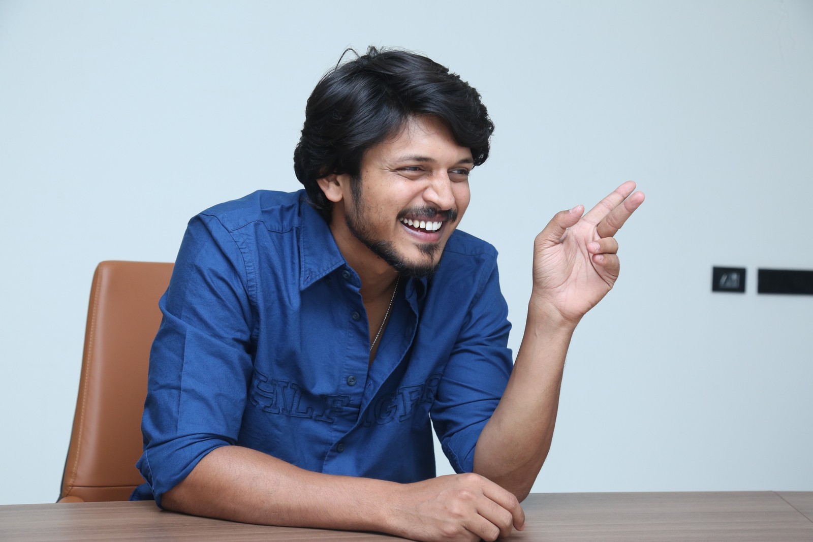 Sumanth Prabhas showcasing smart casual fashion in blue attire