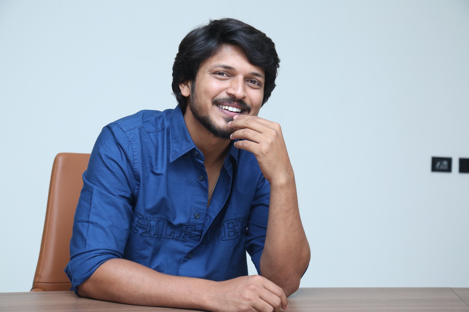 Sumanth Prabhas posing confidently with hand near chin