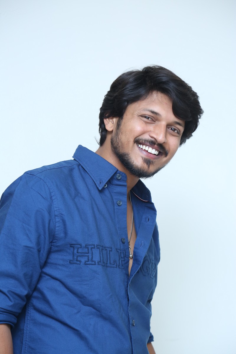 Sumanth Prabhas smiling in stylish blue casual attire