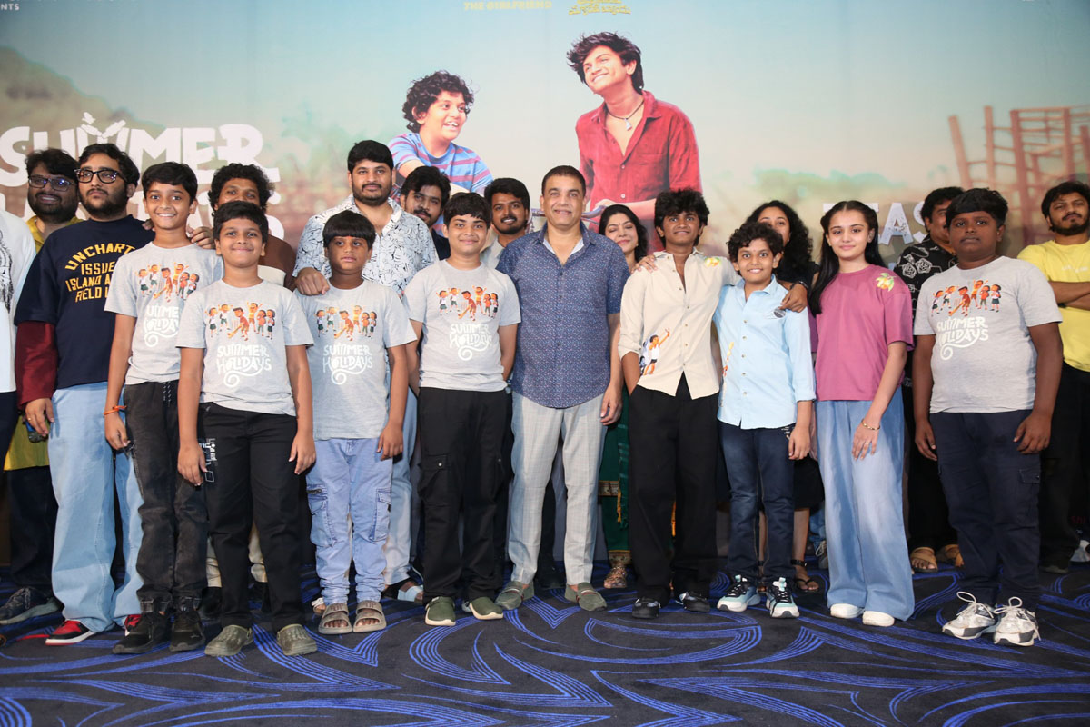 Summer Holidays team posing for media photographs.