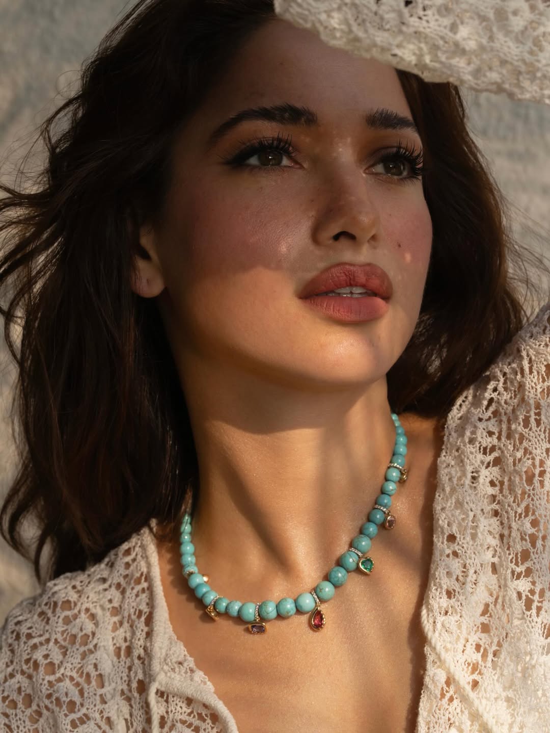 Tamannaah Bhatia wearing turquoise necklace with lace outfit