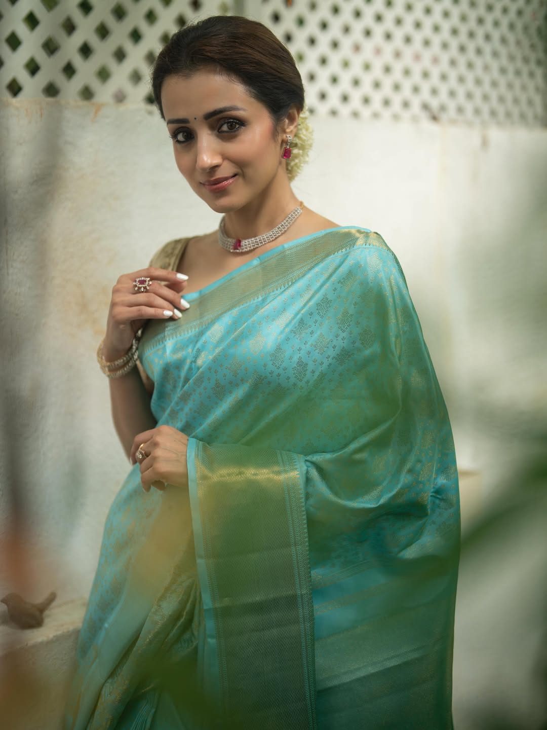 Trisha Krishnan floral bun diamond jewellery style