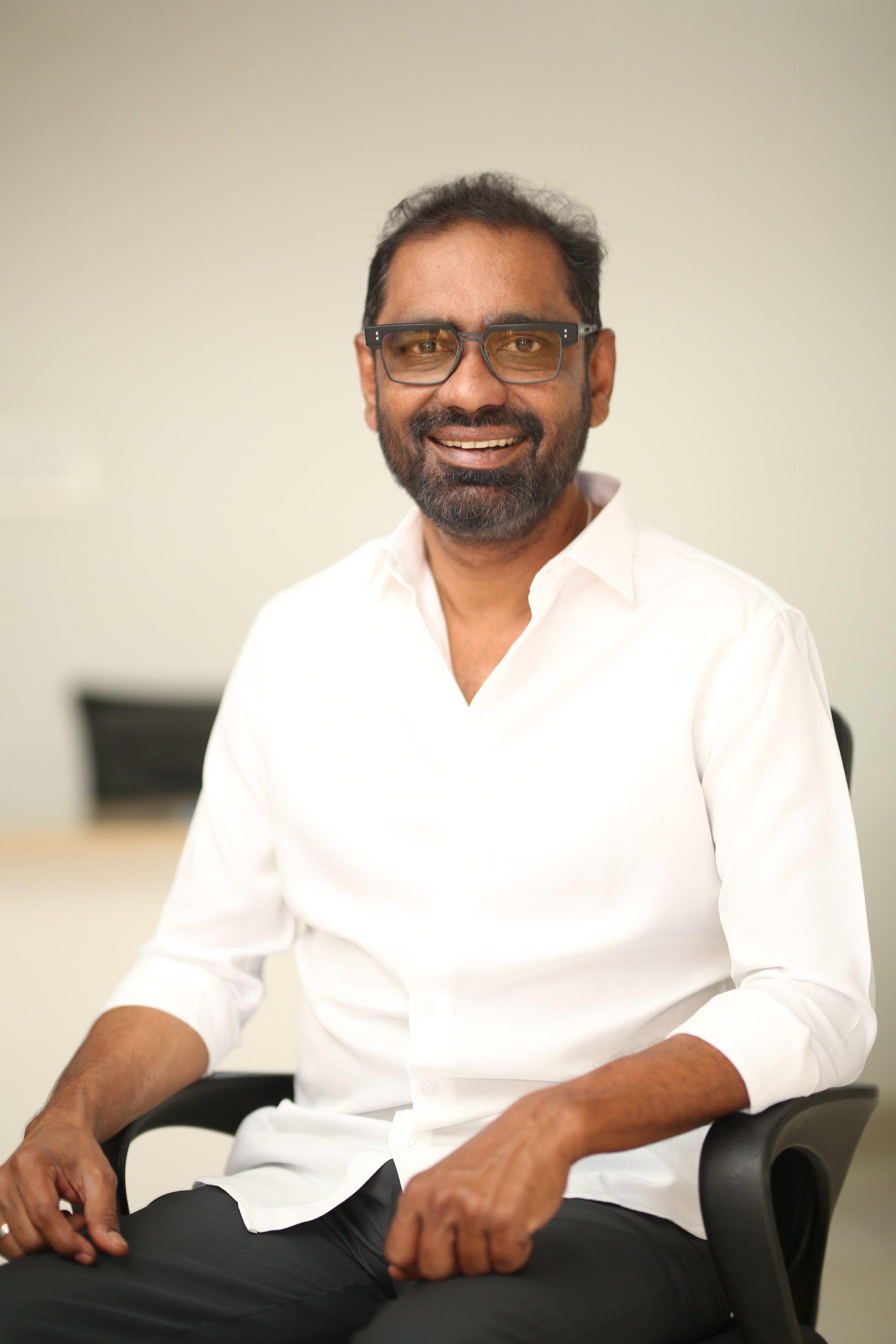 Venkata Satish Kilaru in elegant white shirt look