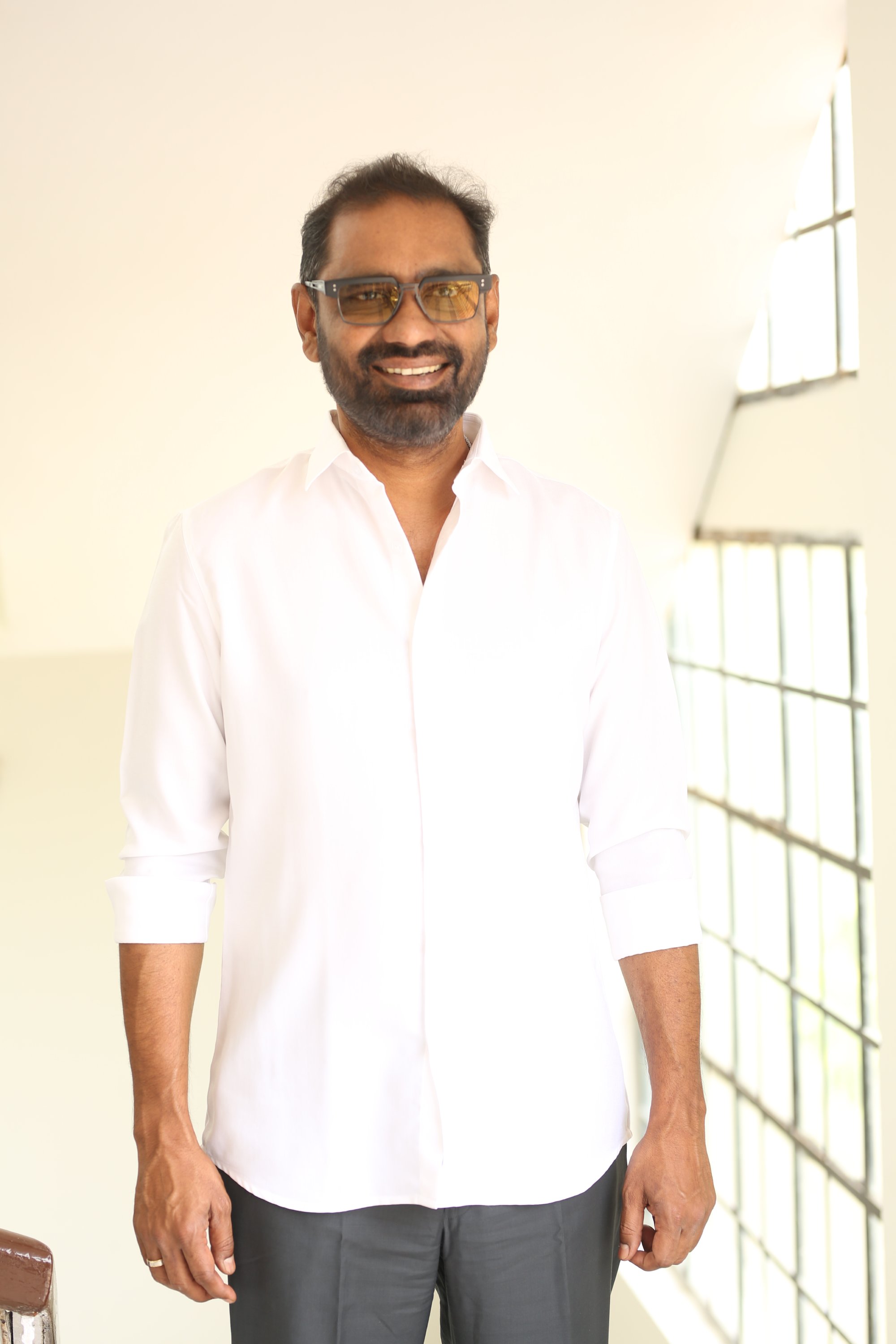 Venkata Satish Kilaru stylish portrait with glasses