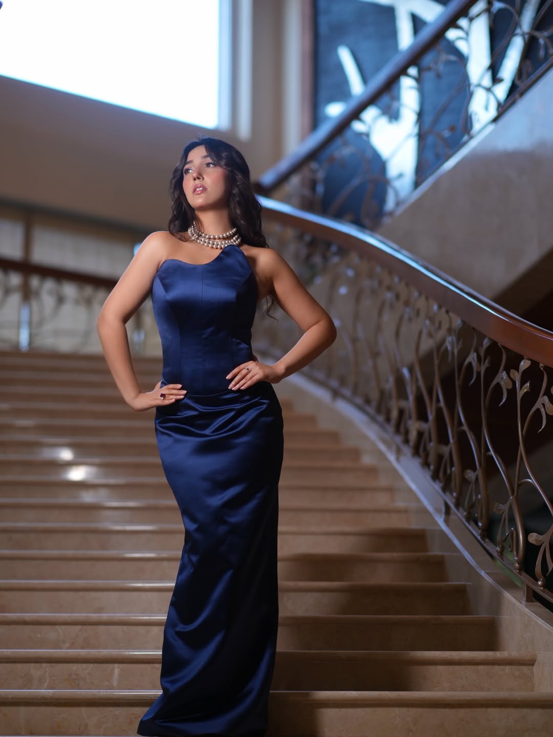 Ashnoor Kaur posing in elegant navy satin