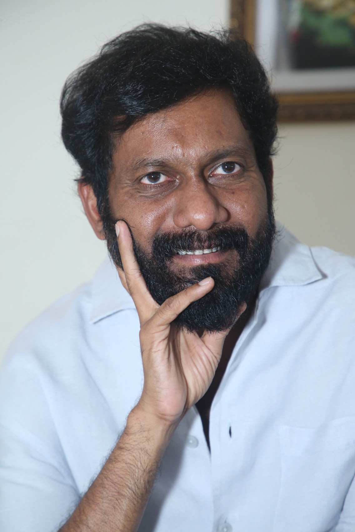 Buchi Babu Sana stylish portrait with groomed beard