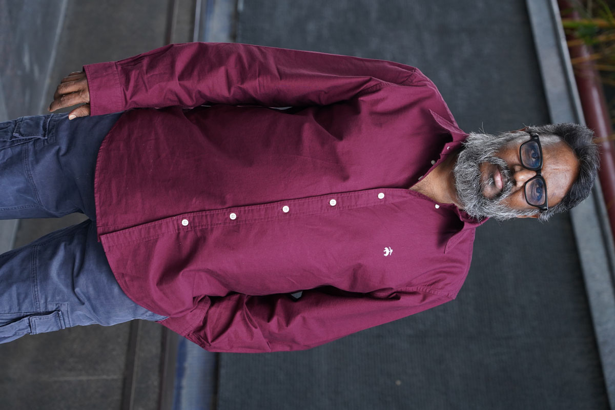 Gunasekhar posing confidently in vibrant stylish attire